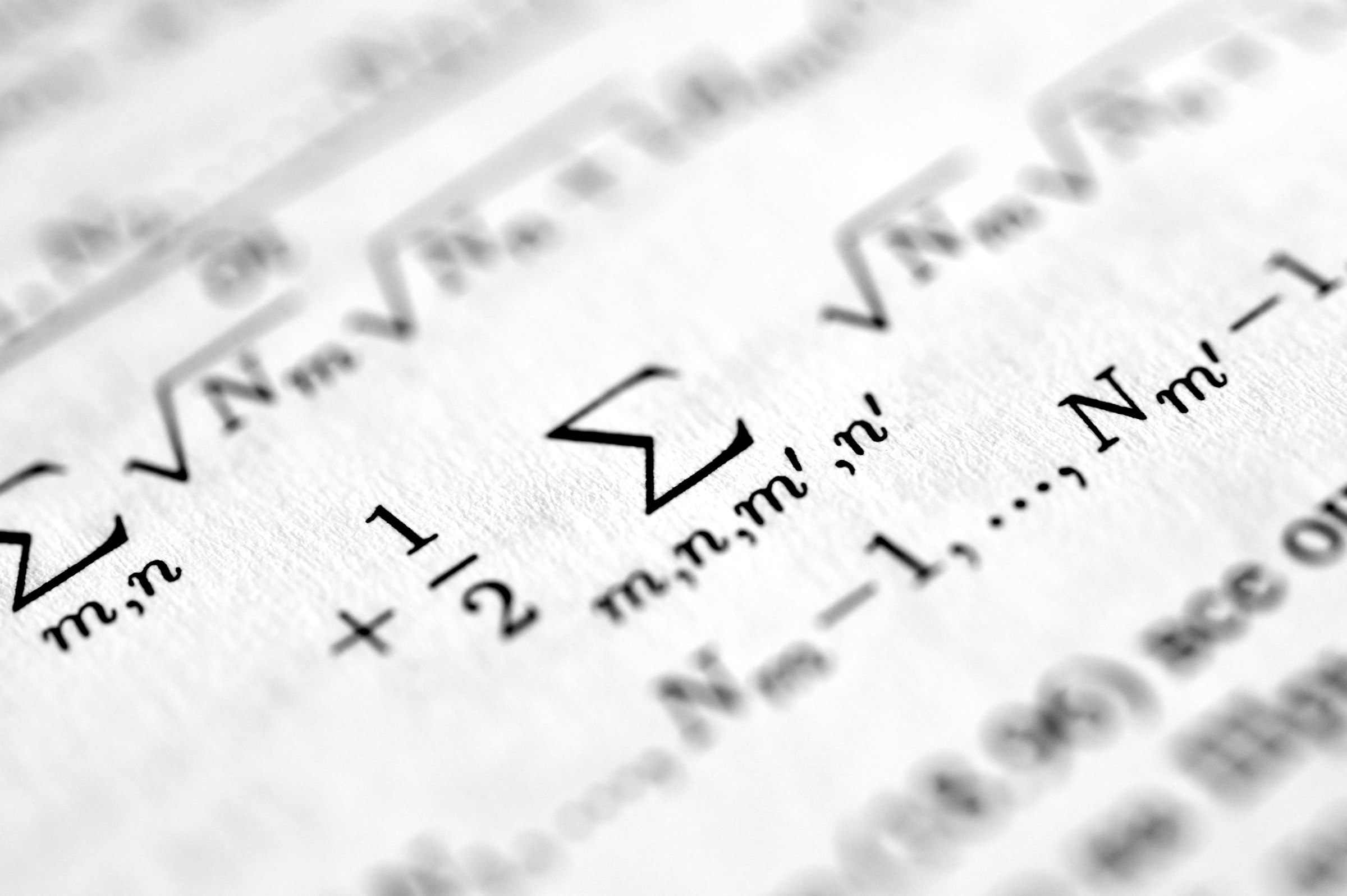 Macro close-up of printed scientific equations, the working papers